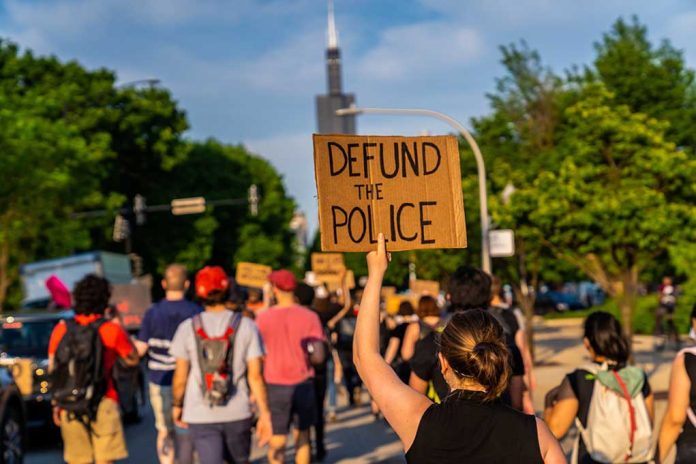 Protesters Picket Mayor's Home After He Dares Suggest Funding Police