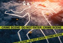 Chalk outline at a crime scene with evidence markers.