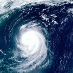 Satellite view of a massive hurricane over the ocean.