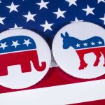 Republican and Democrat symbols on American flag.