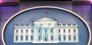 The White House emblem with blue background.