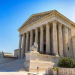 United States Supreme Court building with blue sky