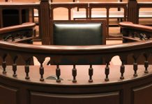 Witness stand in an empty courtroom.