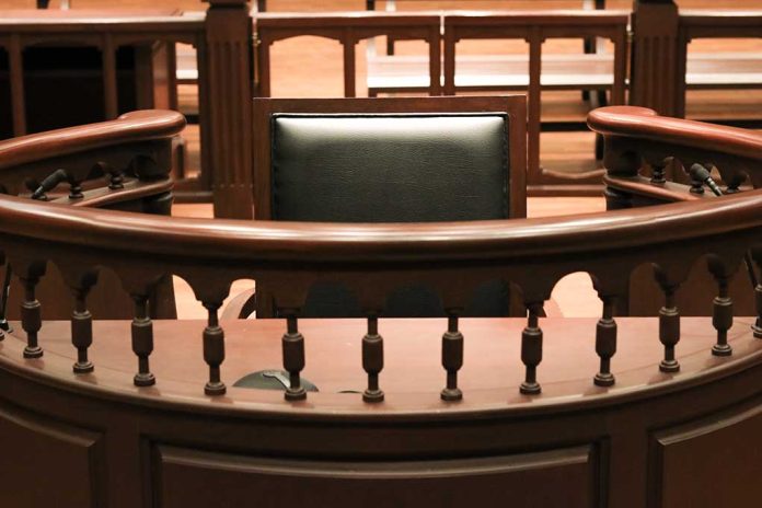 Witness stand in an empty courtroom.