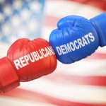 Red and blue boxing gloves with political party names.