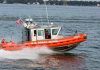 U.S. Coast Guard boat speeding on water.