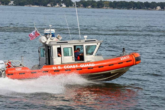 U.S. Coast Guard boat speeding on water.