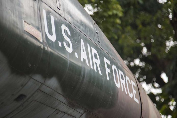 U.S. Air Force plane with trees in background.