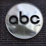 ABC logo on a brick wall.