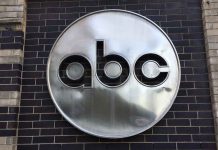 ABC logo on a brick wall.