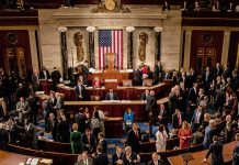 People gathering in United States legislative chamber meeting room