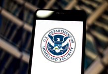 U.S. Department of Homeland Security logo on smartphone.