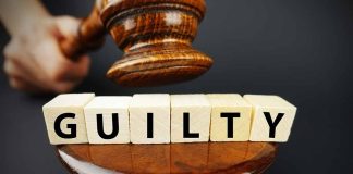 Gavel hitting guilty blocks on a wooden podium
