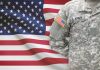 US Army soldier in camouflage with American flag