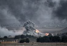 Large explosion with thick smoke on the battlefield