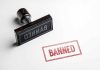 Rubber stamp and red banned imprint on paper