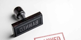 Rubber stamp and red banned imprint on paper