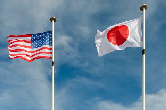 1052272007 featured image USA and Japan flags flying on flagpoles