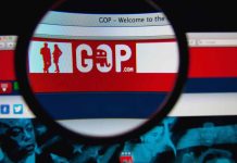 Magnifying glass on GOP website logo on screen