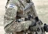 Soldier in camouflage gear with Israeli flag patch