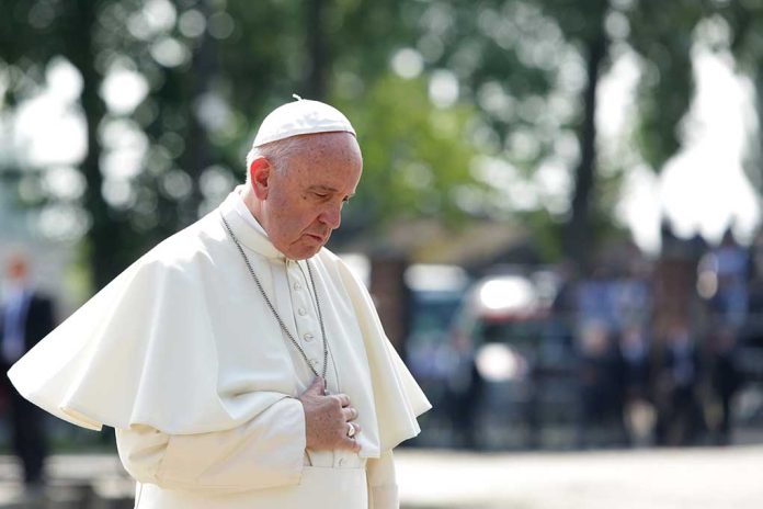 544259368 featured image Man in white religious attire looking down thoughtfully