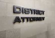 District Attorney sign on stone wall