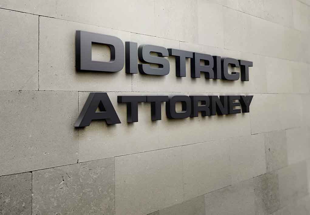 District Attorney sign on stone wall