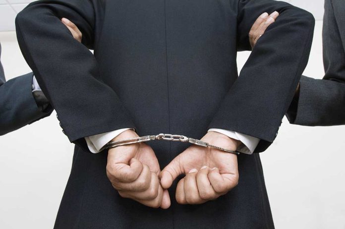 Person handcuffed in suit