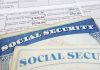 Social security cards on top of tax documents