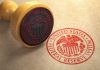 Federal Reserve stamp and wooden stamp on paper