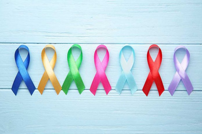 1564226551 featured image Colorful awareness ribbons on light wooden background