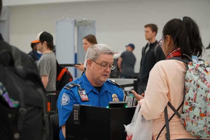 1641623299 featured image TSA agent checks passenger's documents at airport security