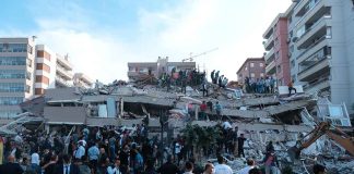 People at a collapsed building after an attack