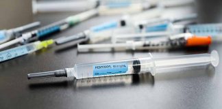 Syringes on table one labeled Fentanyl 50 mcg/ml