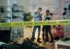 Crime scene with tape and investigators examining evidence