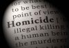 Magnified text showing definition of homicide