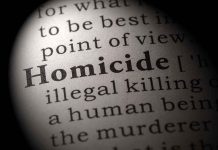 Magnified text showing definition of homicide