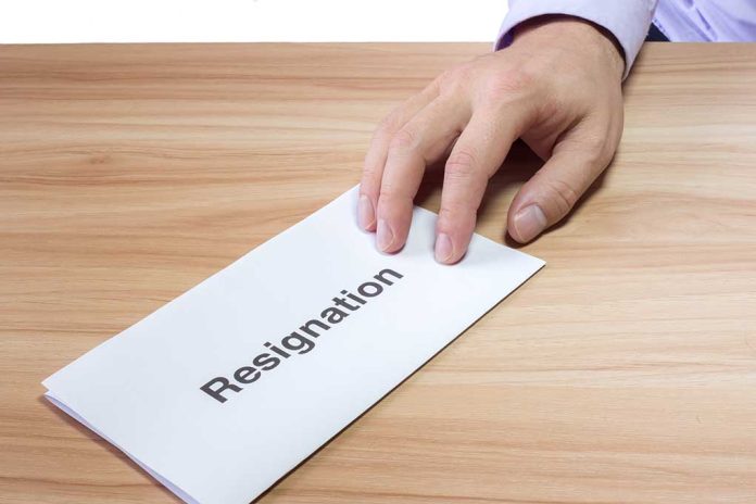 427496692 featured image Hand holding a resignation letter on table