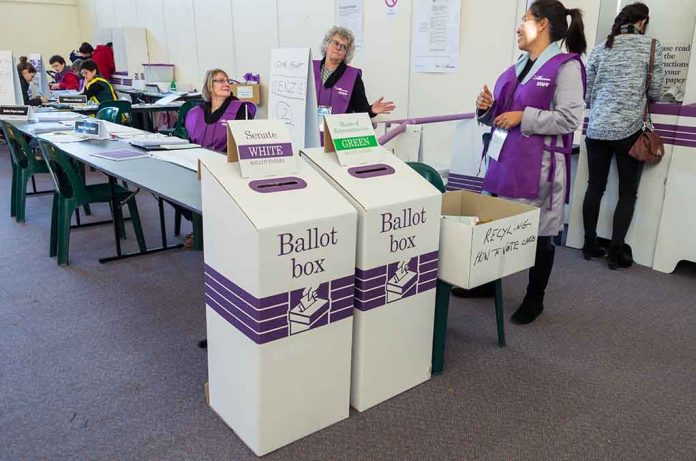 446230945 featured image Election polling station with ballot boxes and officials
