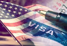 US flag overlaying visa and pen