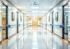 Blurred hospital corridor with doors and lights