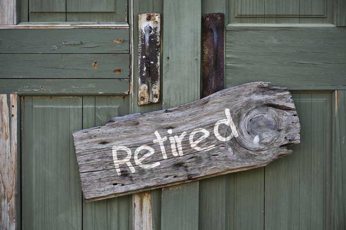 Rustic retired sign on green wooden door