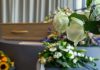 White roses in front of a casket