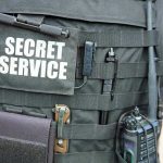 Secret Service vest with various tactical gear attached