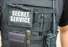 Secret Service vest with various tactical gear attached