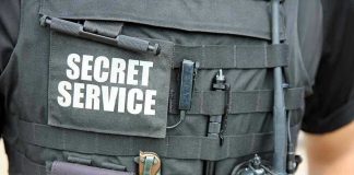 Secret Service vest with various tactical gear attached