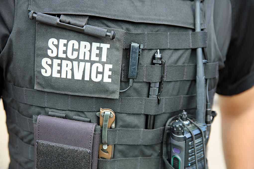 Secret Service vest with various tactical gear attached
