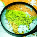 Magnifying glass over United States on map
