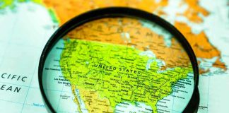 Magnifying glass over United States on map