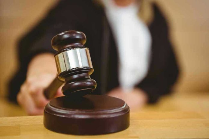 243995698 Judge striking gavel in a courtroom